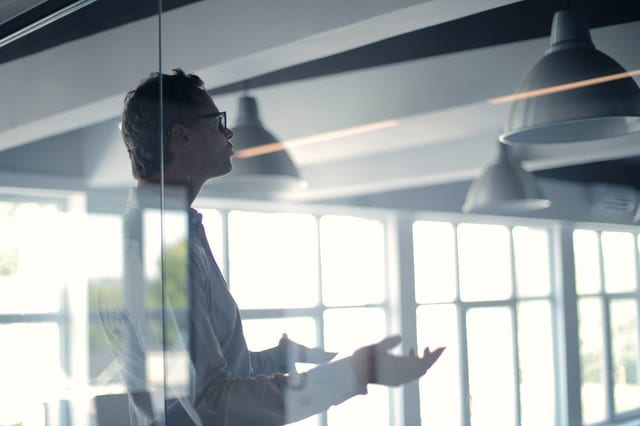 A man in an office, explaining the ways to future-proof your supply chain