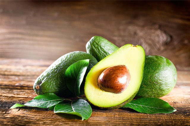 Avocado in a wood background