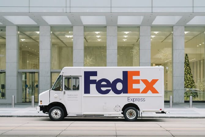 A FedEx van in front of a building