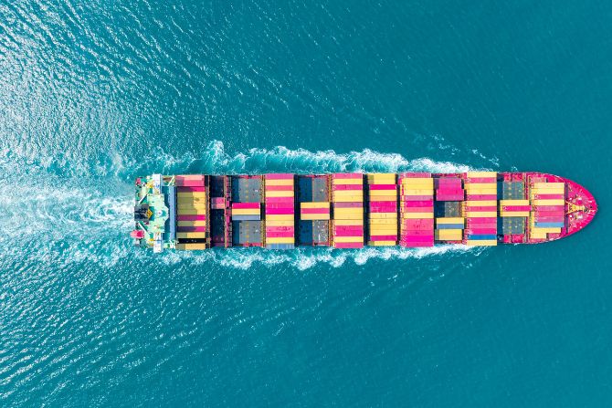 Container ship in motion managed by an ocean freight forwarder