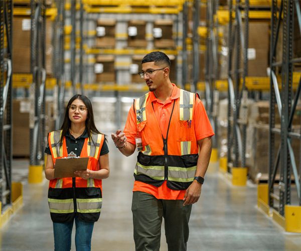 Employees Working At Warehouse Facility