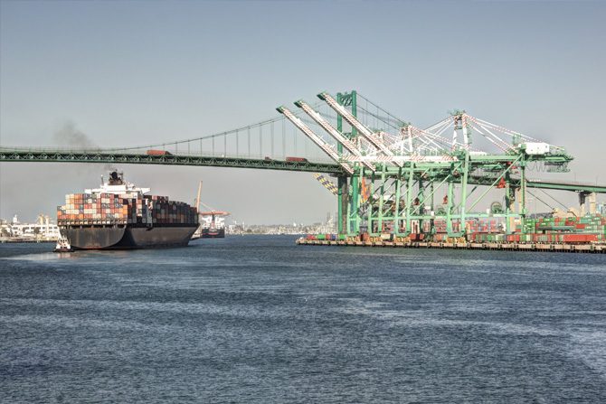 Container ship Vincent Thomas Bridge in San Pedro Port of Los Angeles