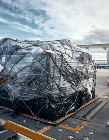 A package going into an airplane for air freight logistics