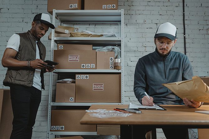 People working in a shipping warehouse.