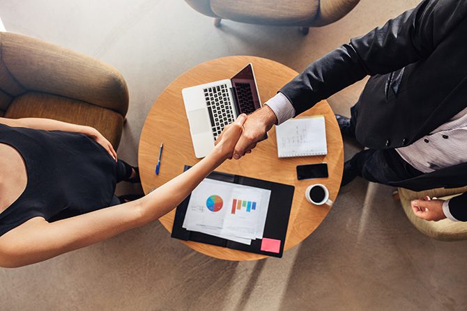 man and woman shaking hands